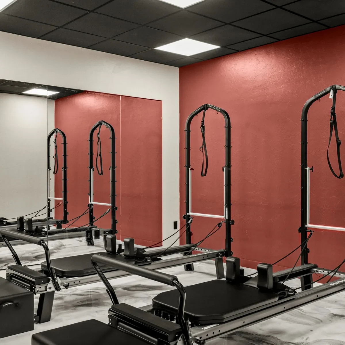 Allegro NextGen reformers with towers in the Reformer Pilates room at FusionFit239, Fort Myers
